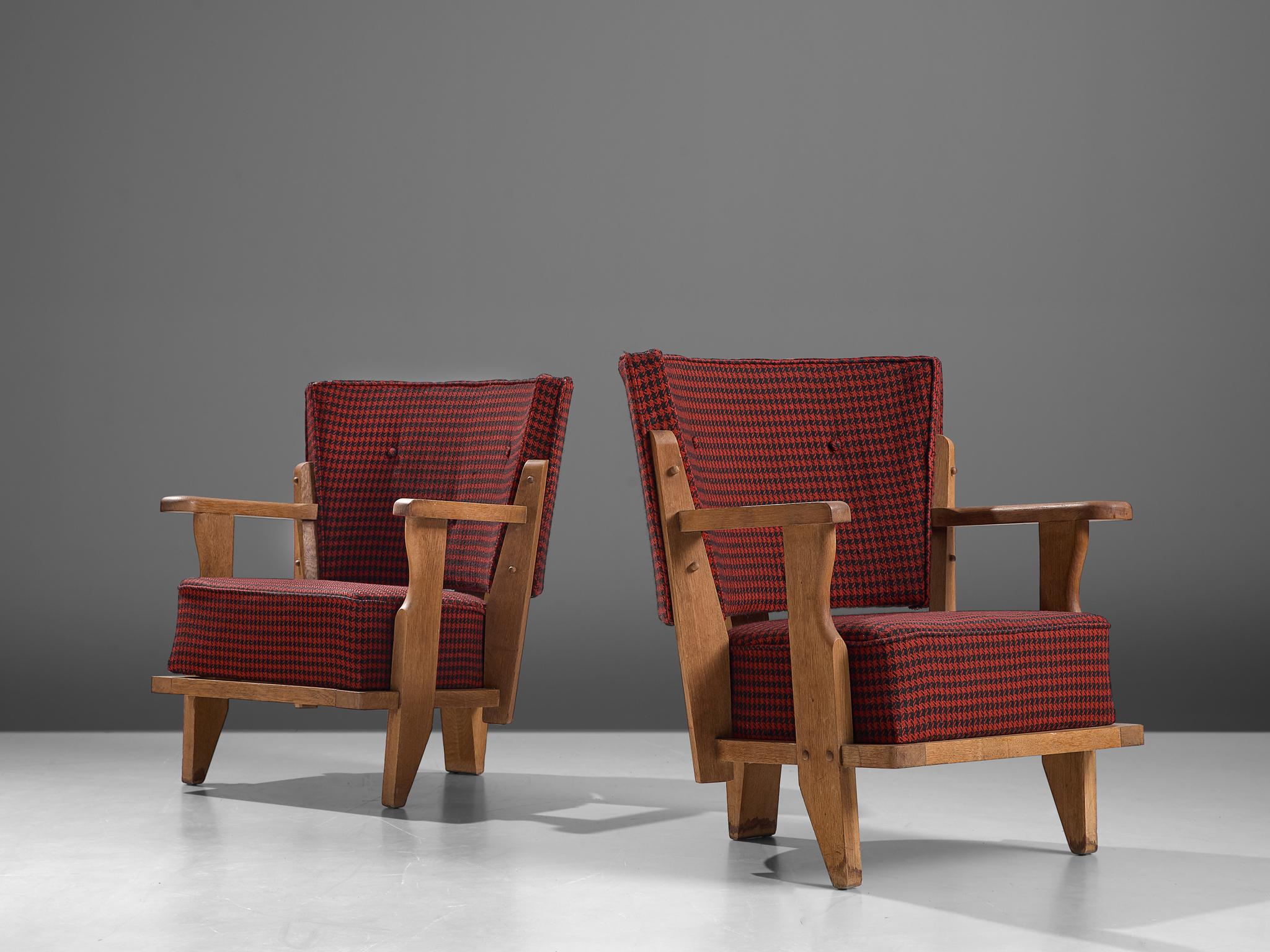 Guillerme & Chambron for Votre Maison, pair of lounge chairs, fabric and oak, France, 1960s.

An extraordinary Guillerme and Chambron pair of lounge chair in solid oak with the typical characteristic sturdy carved frame. The sculptural chair