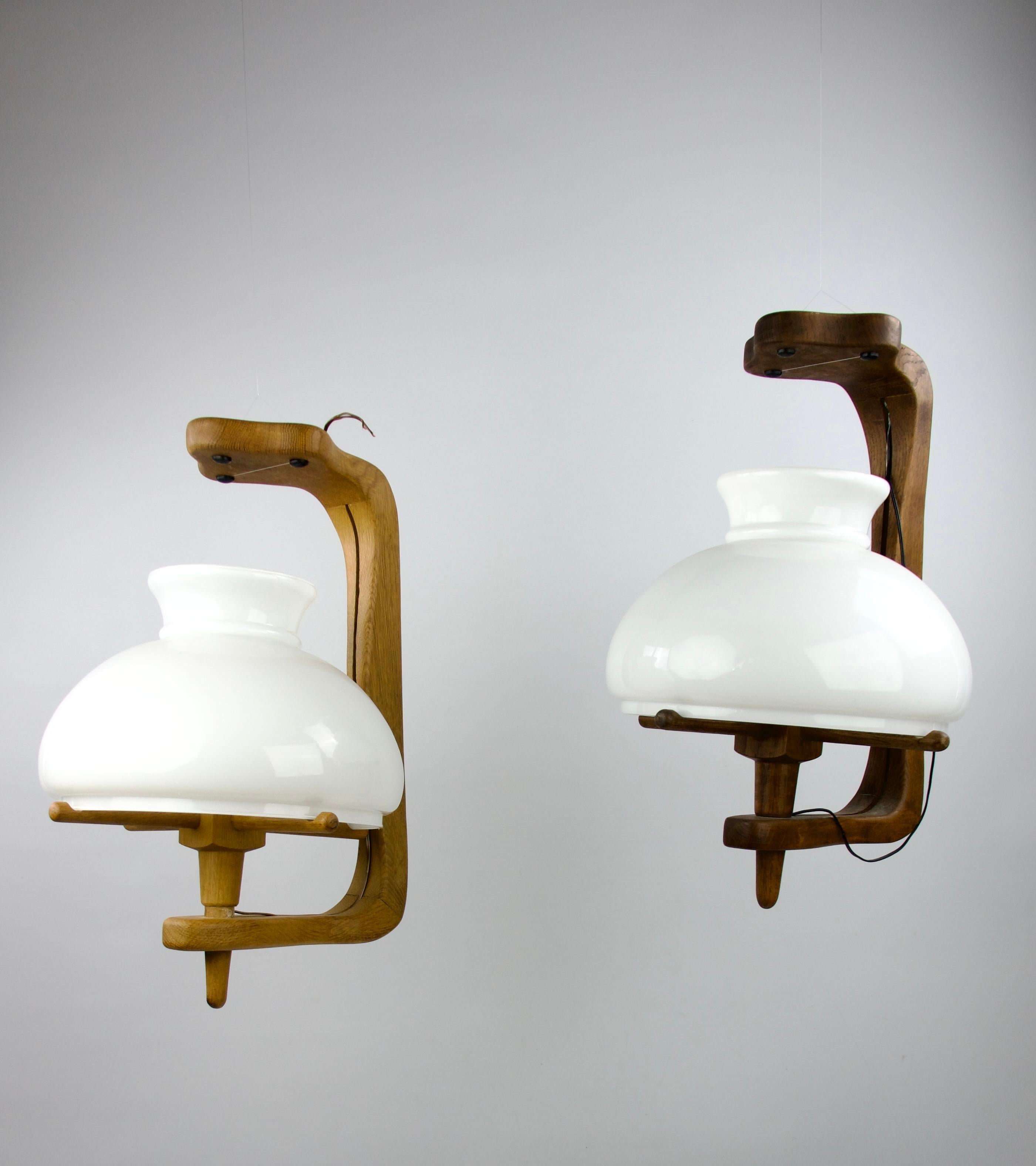 Set of two beautiful Guillerme et Chambron ceiling chandeliers with their opaline lamp shades for the Votre Maison editor. France, 1960s.

Very good condition.

Dimensions in cm ( H x L x l ) : 52.5 x 30 x 36

Secure shipping.