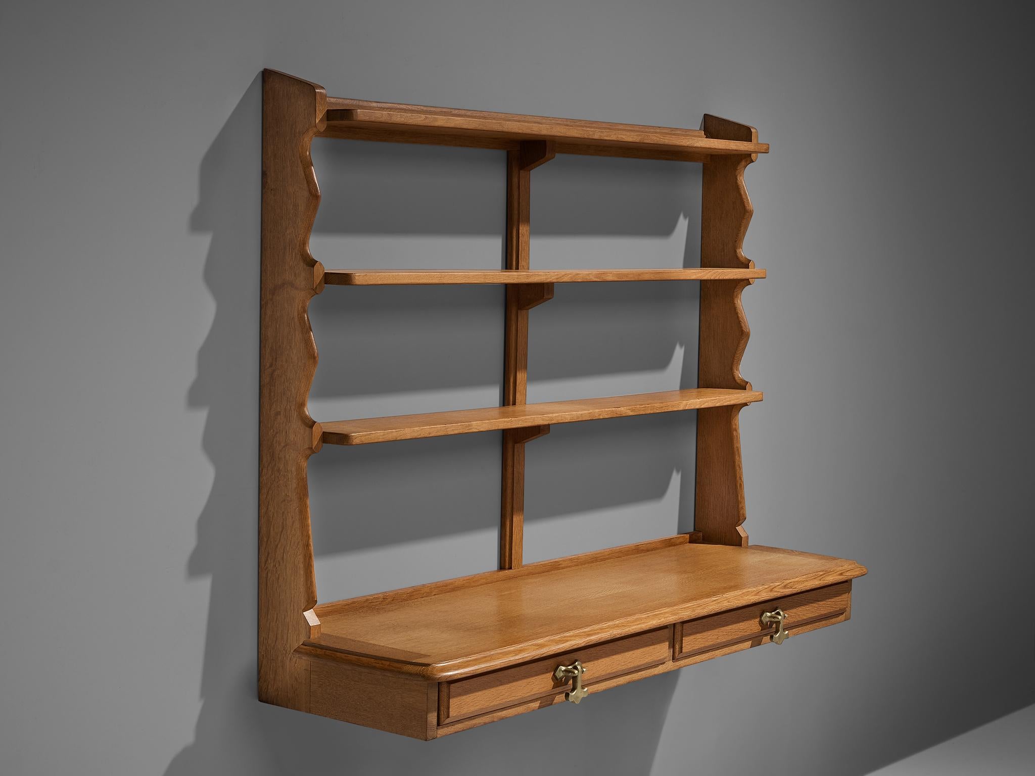 Guillerme et Chambron for Votre Maison, wall-mounted shelf with drawers, oak, brass, France, 1960s

Guillerme et Chambron designed this wall-mounted shelf so that it can be used on top of a sideboard and function as open showcase to your most