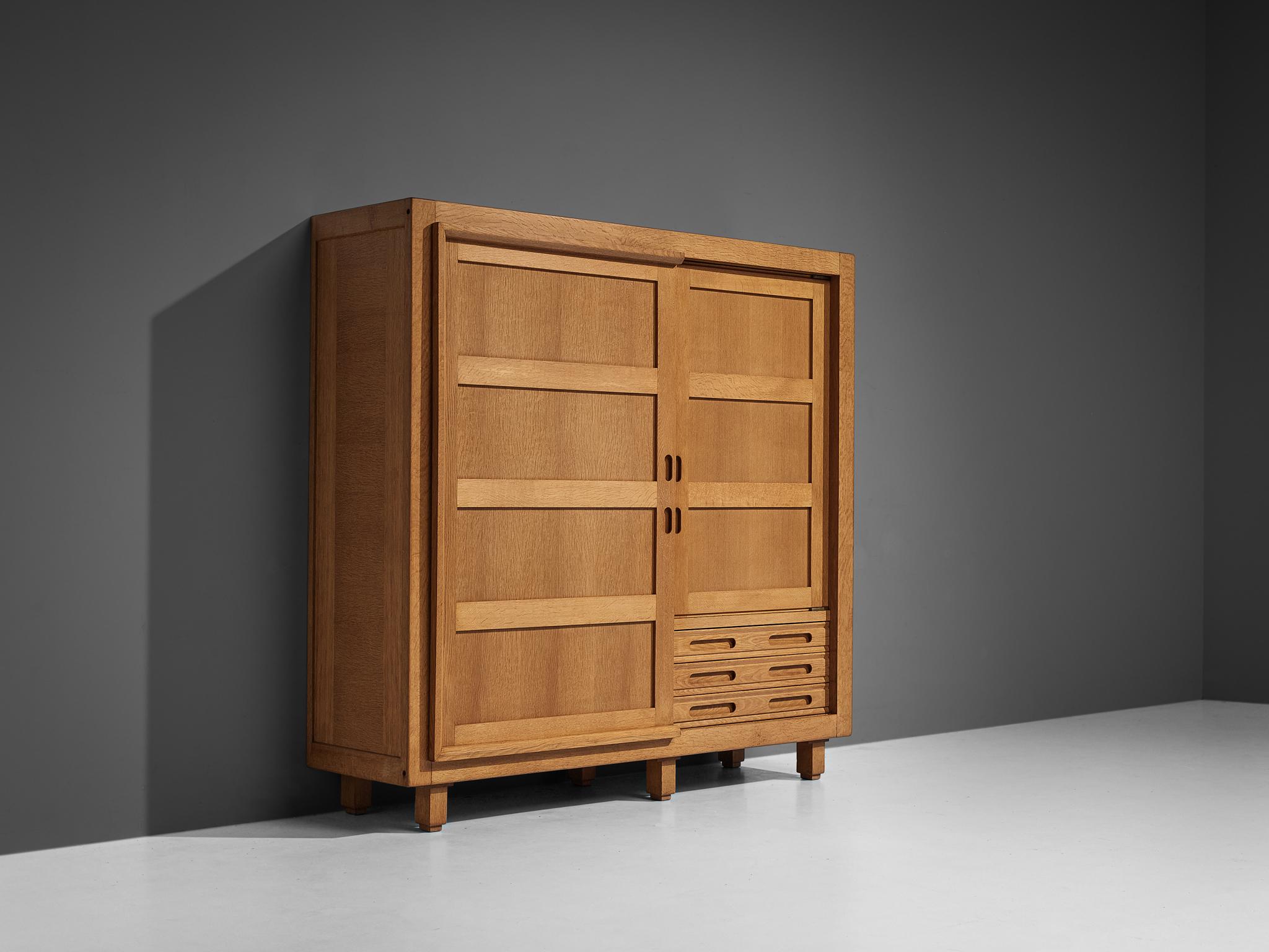 Guillerme et Chambron, large highboard, oak, France, 1960s

This grandiose highboard is a good example of excellent woodworking by virtue of the well-designed construction based on innovative wood joints and geometrical shapes that create a rhythmic