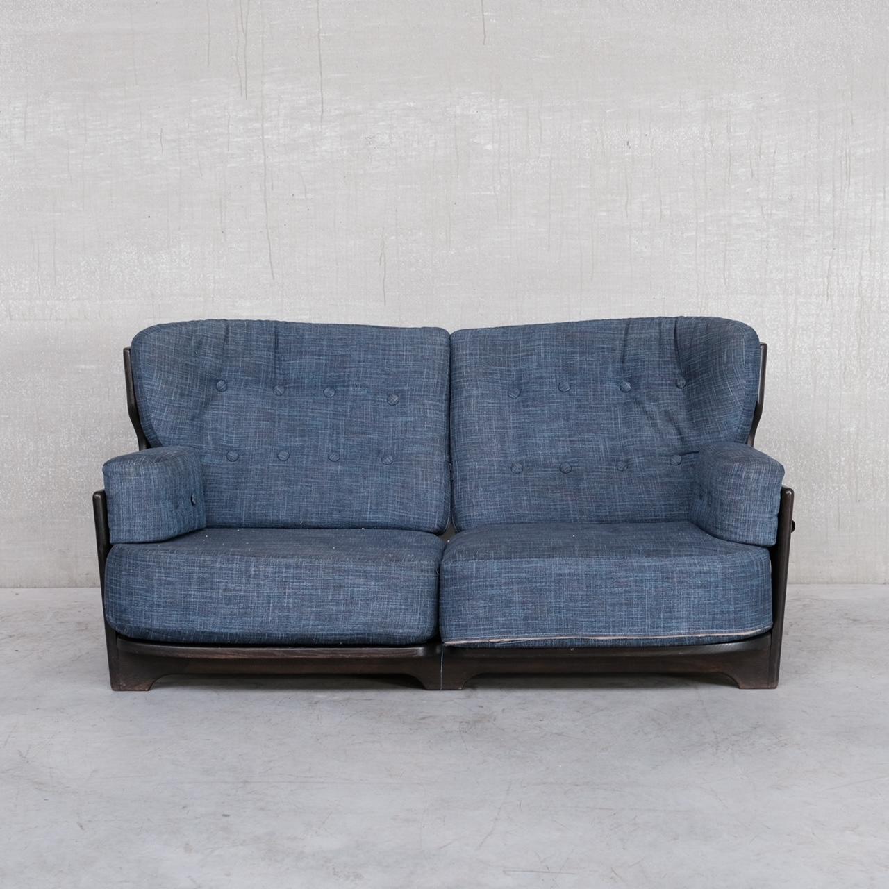 A rare two seater sofa by Guillerme et Chambron. 

France, c1960s. 

Stained oak frame with original upholstery retained. 

The frame remains in good condition, the upholstery is usable but probably wants updating. 

Location: Belgium