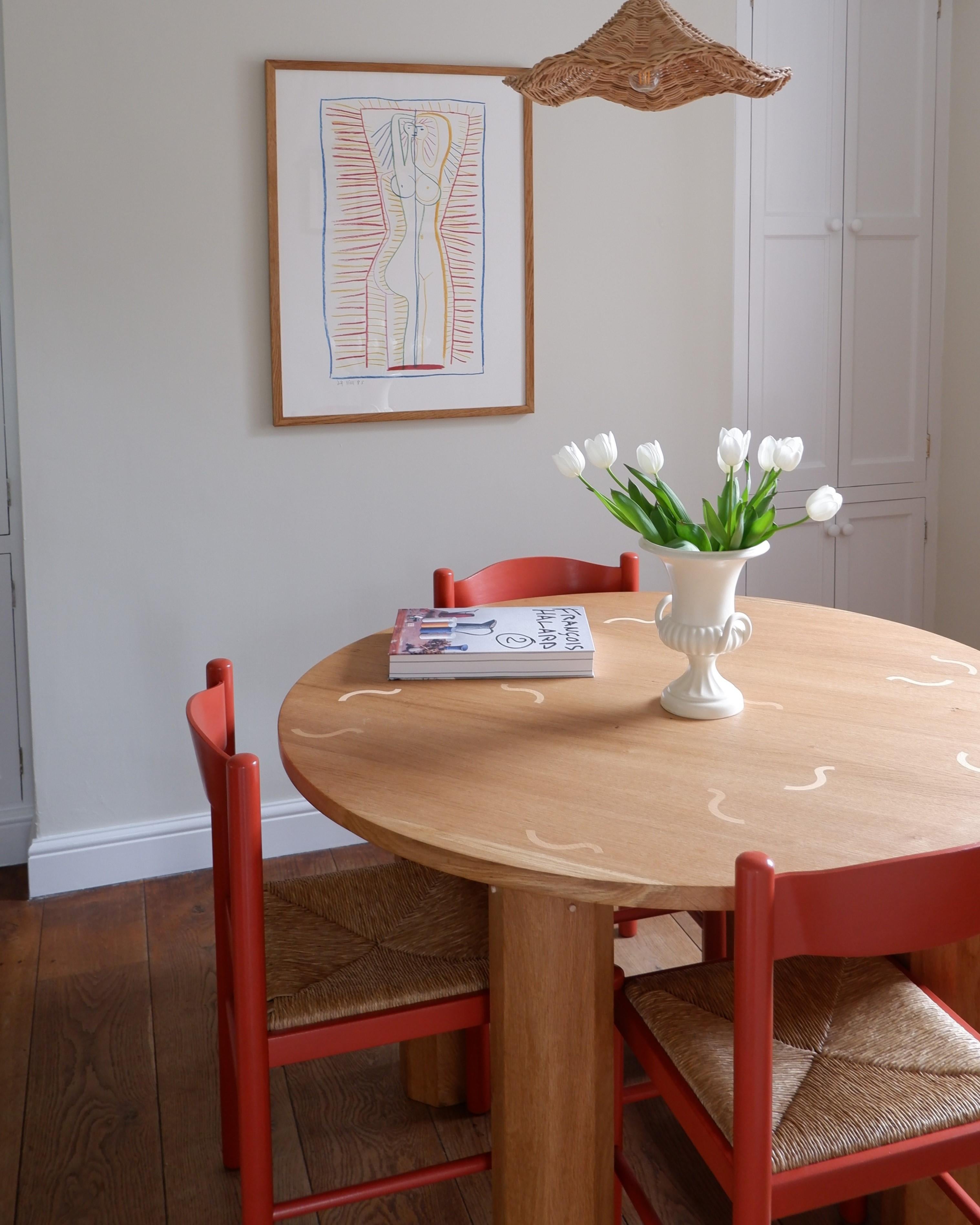 Part of the Cubist Collection, the Guilloche Dining Table is hand crafted from solid white oak. 

Featuring oversized octagonal legs with arched support for the round tabletop and inlaid with beech in a random guilloche design.

The table is
