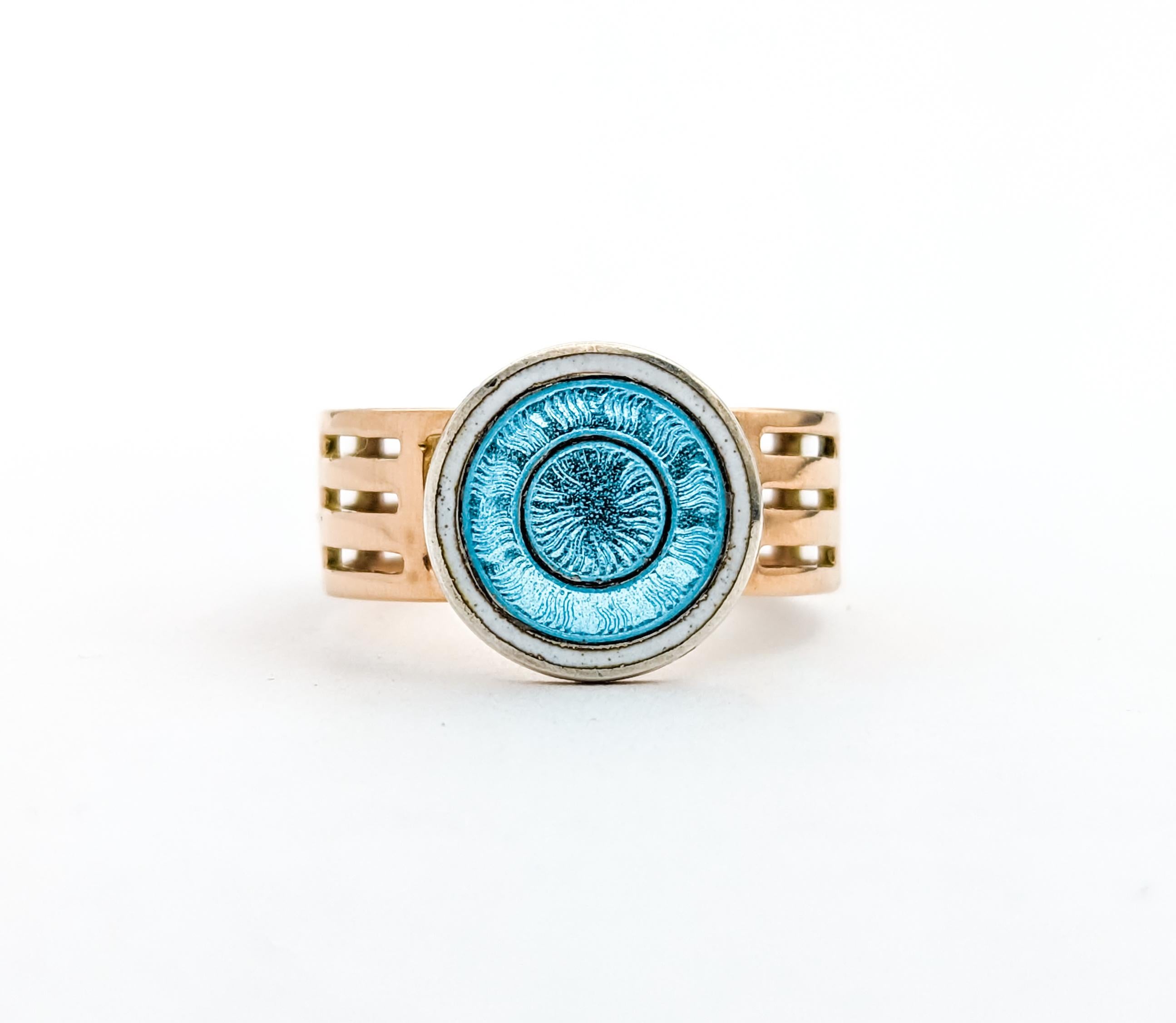 Enamelled Blue Disc Ring In Yellow Gold

Discover the charm of this vintage enamel ring, masterfully crafted in 14k yellow gold. This unique piece features an eye-catching Guilloché enameled blue disc with a white border as its centerpiece. The wide