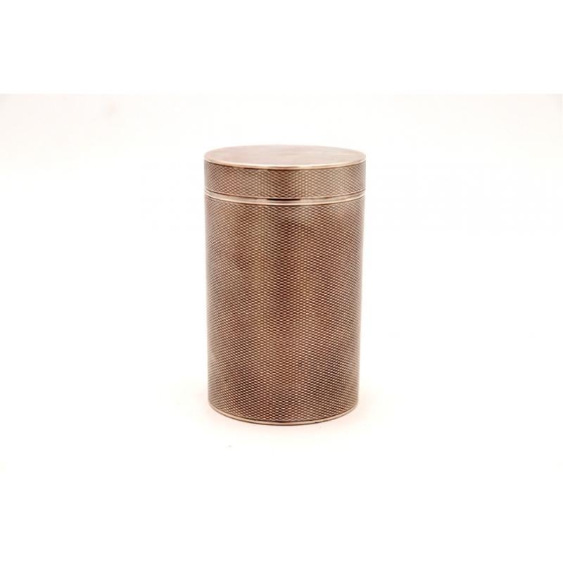 Description: Guilloche silver box, cylindrical, with a smooth, removable lid. Metal: Silver. Origin: French. Brand: Tête Minerce. Weight: 167.69 grams. Dimensions: 6cm x 9.5cm. Content: 950/1000. Assay Mark: Yes, since 1838. Additional information: