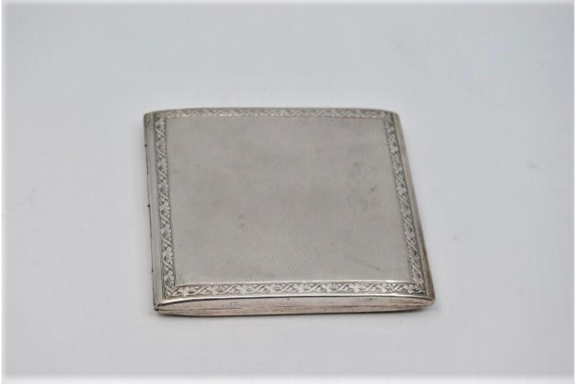 Description: Square-shaped guilloche silver card case. Metal: Silver. Origin: Portuguese. Brand: Eagle Head. Weight: 96.42 grams. Dimensions: 7.5x8.5cm. Content: 833/1000. Assay Mark: Yes, between 1938 and 1984. Additional information: Signs of use.