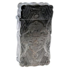 Guilloche silver cardboard box with engraved city motifs and wavy border