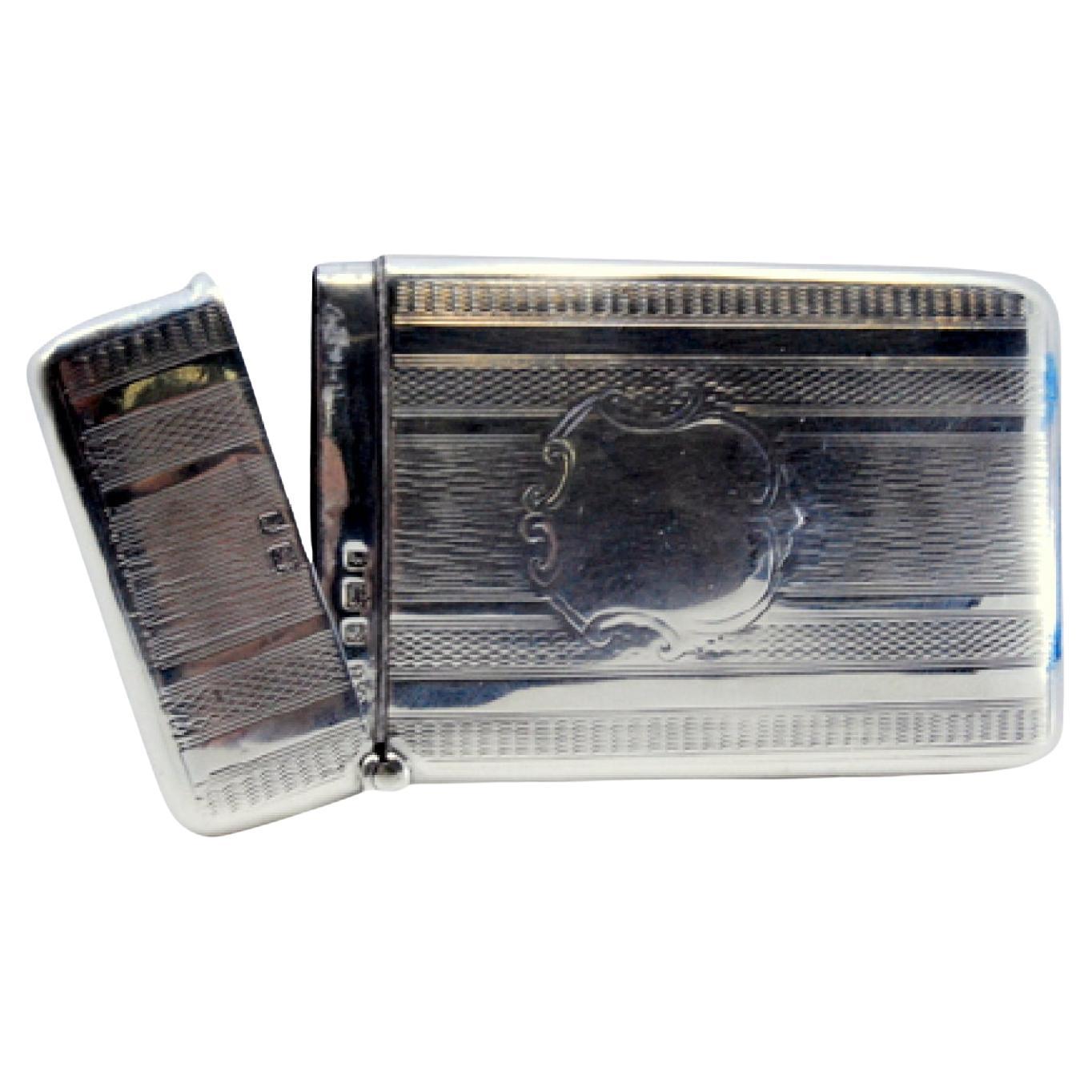 Guilloche silver carton with hinged lid enclosing monogram card