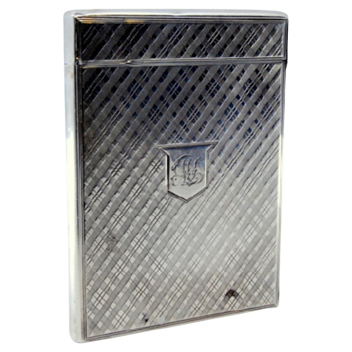 Guilloche silver cartoner with central monogram card and hinged lid