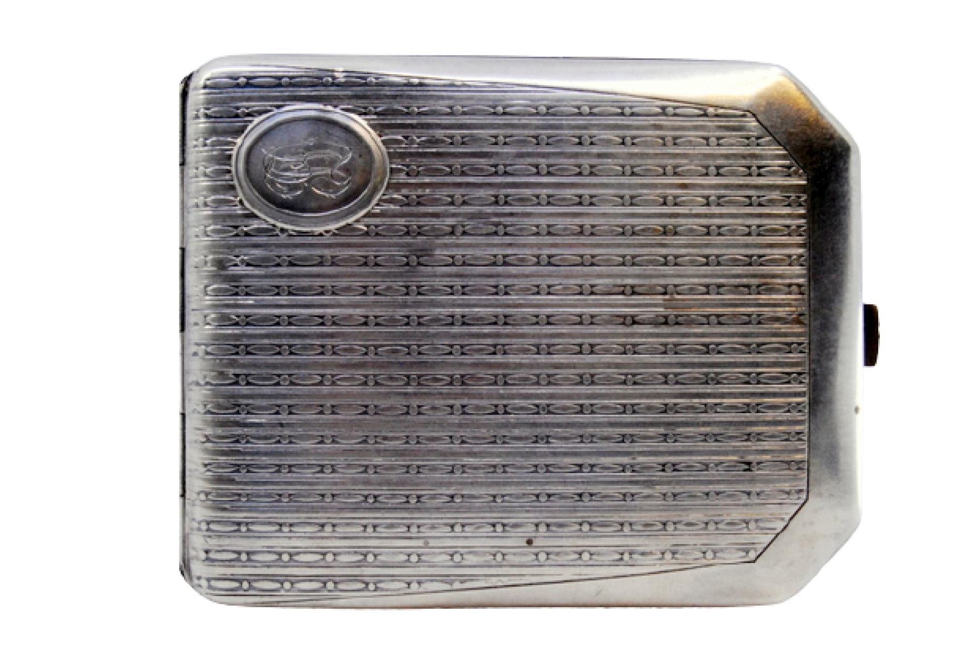 Description: Guilloche silver cigarette case with beveled corners surrounding a monogram card and hinged lid. Metal: Silver. Origin: Portuguese. Brand: javali II Title. Weight: 114.36 grams. Dimensions: 10x8cm. Content: 833/1000. Assay Mark: Yes,