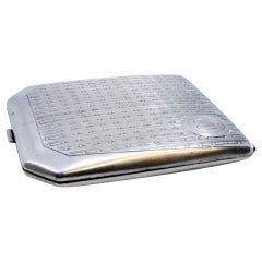 Guilloche silver case with beveled corners, monogram plate and hinged lid