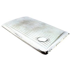 Guilloche silver case with lengthwise bands, monogram and gold interior