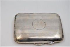 Guilloche silver case with top bands around monogram and hinged lid