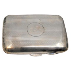 Guilloche silver case with top bands around monogram and hinged lid
