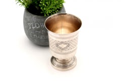 Guilloche silver chalice with reliefs