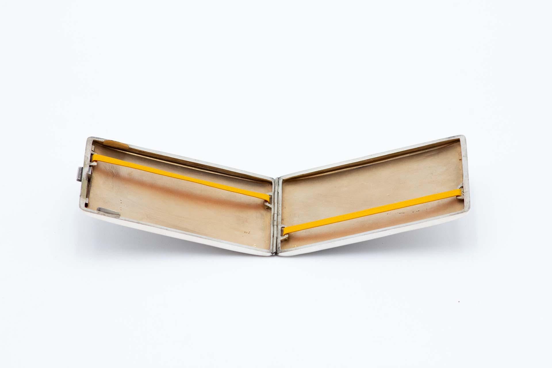 Description: Rectangular guilloche silver cigarette case with gold interior. Metal: Silver. Origin: Portuguese. Brand: Eagle Head. Weight: 105.03 grams. Dimensions: 11.3cmx1cm. Content: 833/1000. Assay Mark: Yes, between 1938 and 1984. Additional