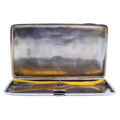 Guilloche silver cigarette case on both sides w/ a monogram card
a hinged lid