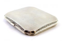 Guilloche silver cigarette case w/ beveled corners, gold interior & hinged lid