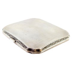 Guilloche silver cigarette case w/ beveled corners, gold interior
hinged lid