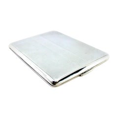 Guilloche silver cigarette case with bands along the length and spring lid