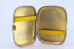 Guilloche silver cigarette case with curved bands and a gold interior
