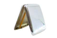 Guilloche silver cigarette case with curved bands at the top and gold interior