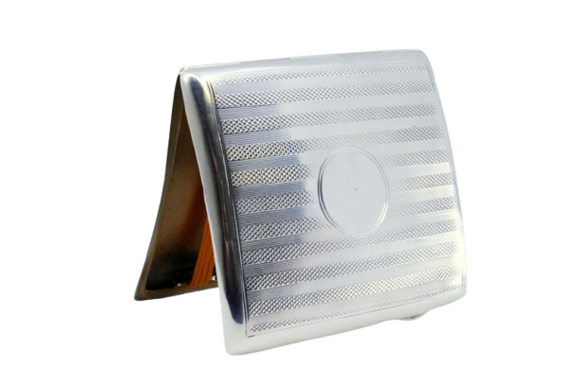 Description: Guilloche silver cigarette case with curved top bands and hinged lid. Metal: Silver. Origin: English. Brand: Birmingham. Weight: 76.97 grams. Dimensions: 8.5x7.5cm. Content: 925/1000. Assay Mark: Yes, 1902 by Samuel M. Levi. Additional