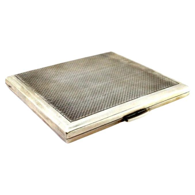 Guilloche silver cigarette case with hinged lid and gold interior