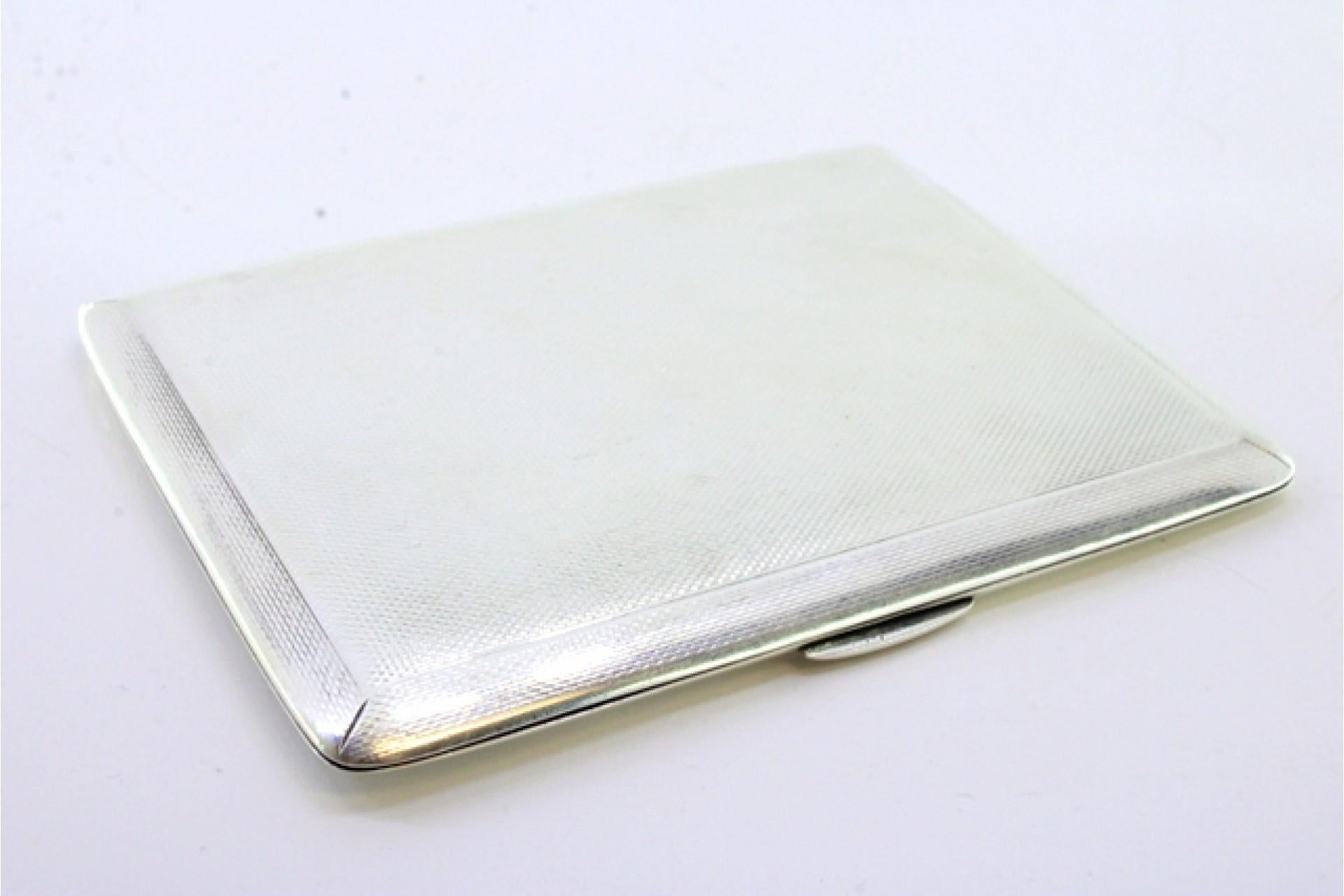 Description: Guilloche silver cigarette case with hinged lid and spring. Metal: Silver. Origin: English. Mark: Unreadable. Weight: 162.89 grams. Dimensions: 11cmx8.5cm. Content: 925/1000. Assay Mark: Yes. Additional information: Good condition.