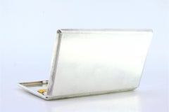 Guilloche silver cigarette case with interior cigarette ribbon and hinged lid