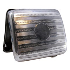 Guilloche silver cigarette case with monogram 
interior holder