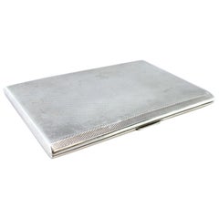 Guilloche silver cigarette case with opening application and gold interior