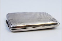 Guilloche silver matchbook in the shape of a radiance and with a hinged lid