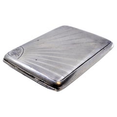 Guilloche silver matchbook in the shape of a radiance and with a hinged lid