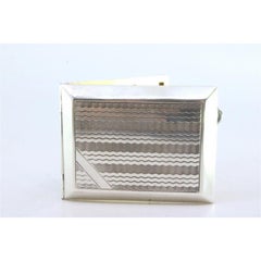 Guilloche silver matchbook with gold interior and hinged lid