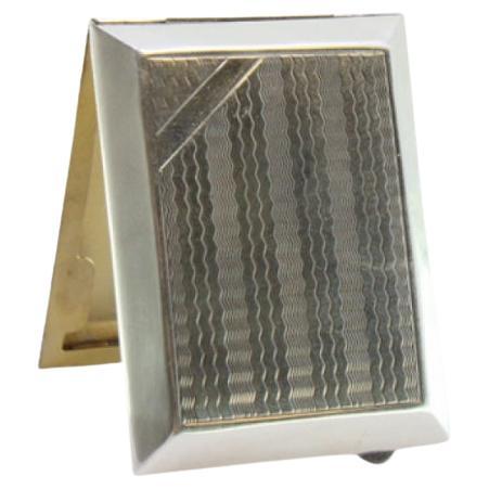 Guilloche silver matchbook with gold interior and hinged lid