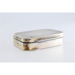 Guilloche silver pill box with beveled corners on the hinged lid