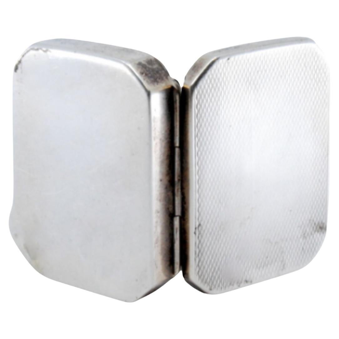 Guilloche silver pill box with beveled corners on the hinged lid