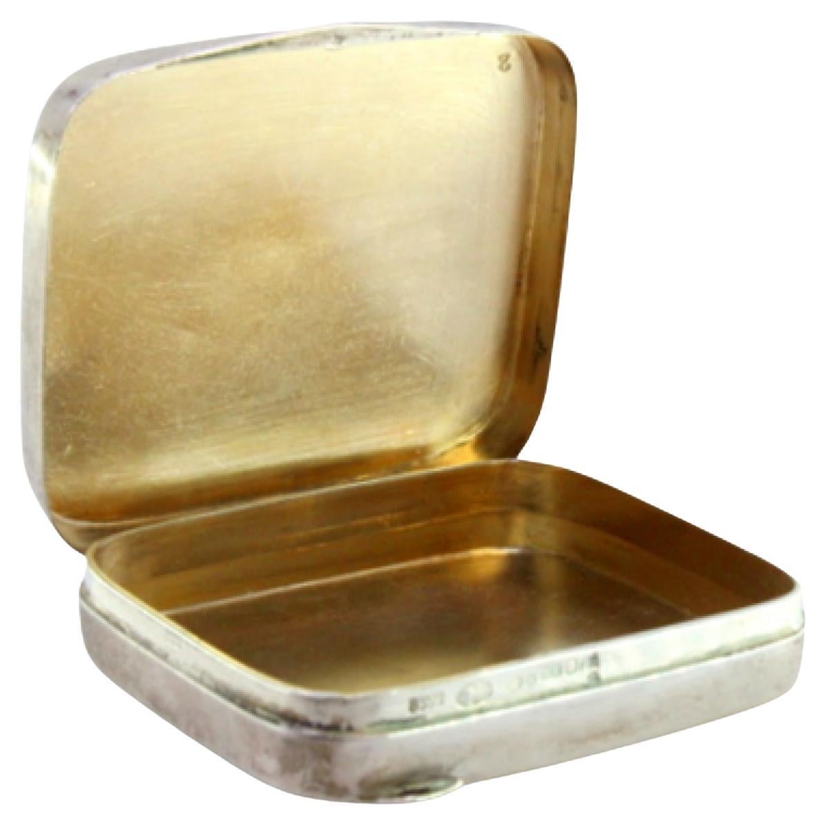 Guilloche silver pill box with gold interior and hinged lid