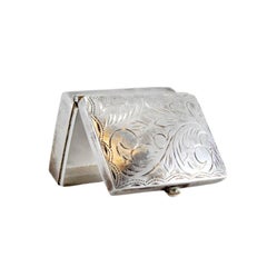 Guilloche silver pill box with plant motifs and hinged lid