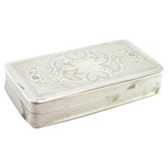 Guilloche silver snuff box with floral motifs and monogram