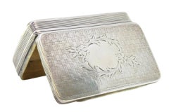 Guilloche silver snuff box with monogram, friezes and floral lid