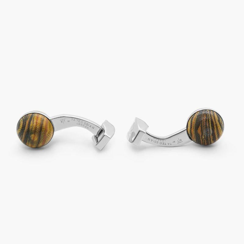 Guilloche Sphere cufflinks with tiger eye

Our iconic Guilloche pattern is intricately carved on tiger eye spheres, replicating the finishes of sophisticated watch dials. An intricate and complex process which requires incredible attention to detail