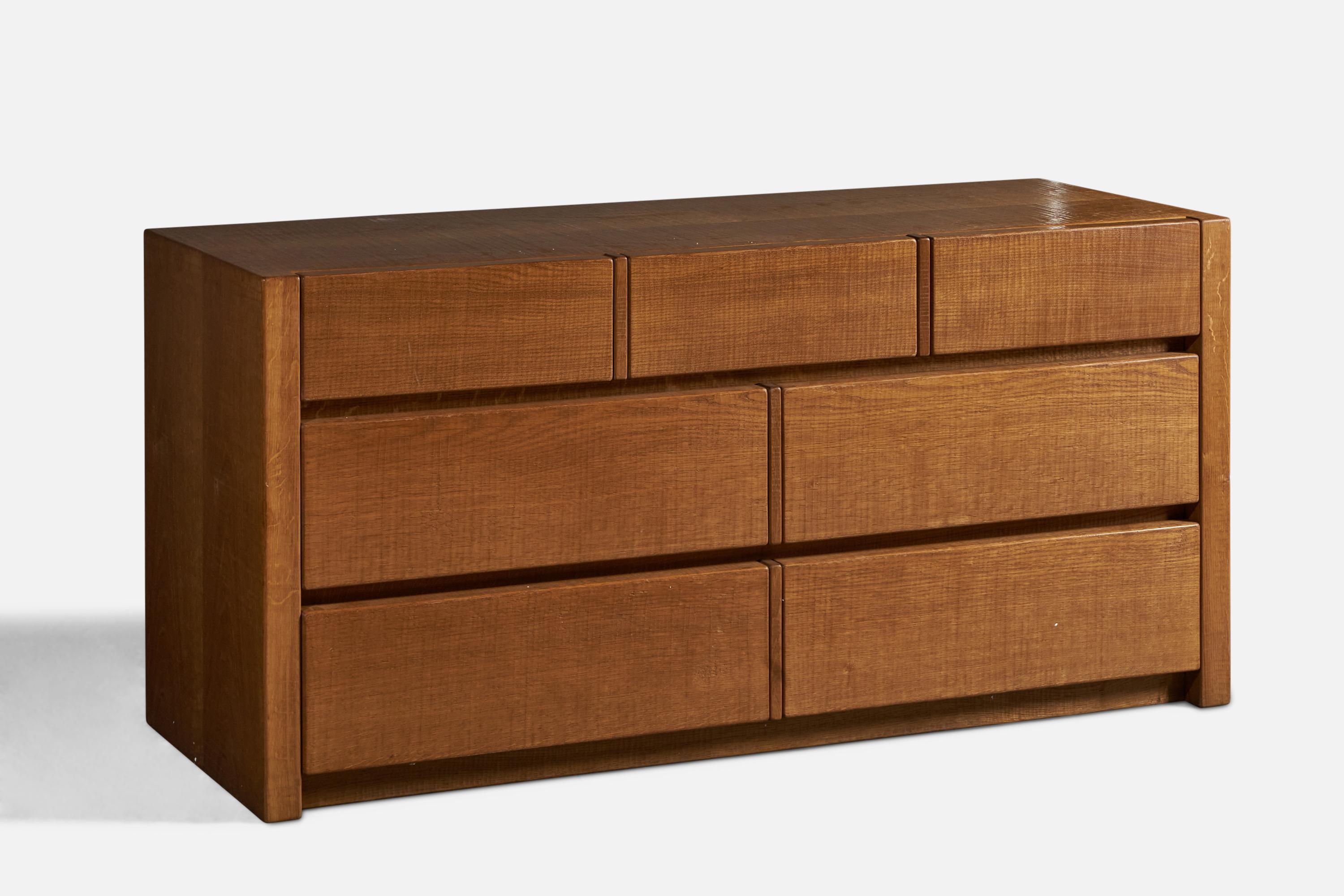 A solid oak chest of drawers or dresser, designed by Guiseppe Rivadossi and produced by Officina Rivadossi, Italy, c. 1980s.