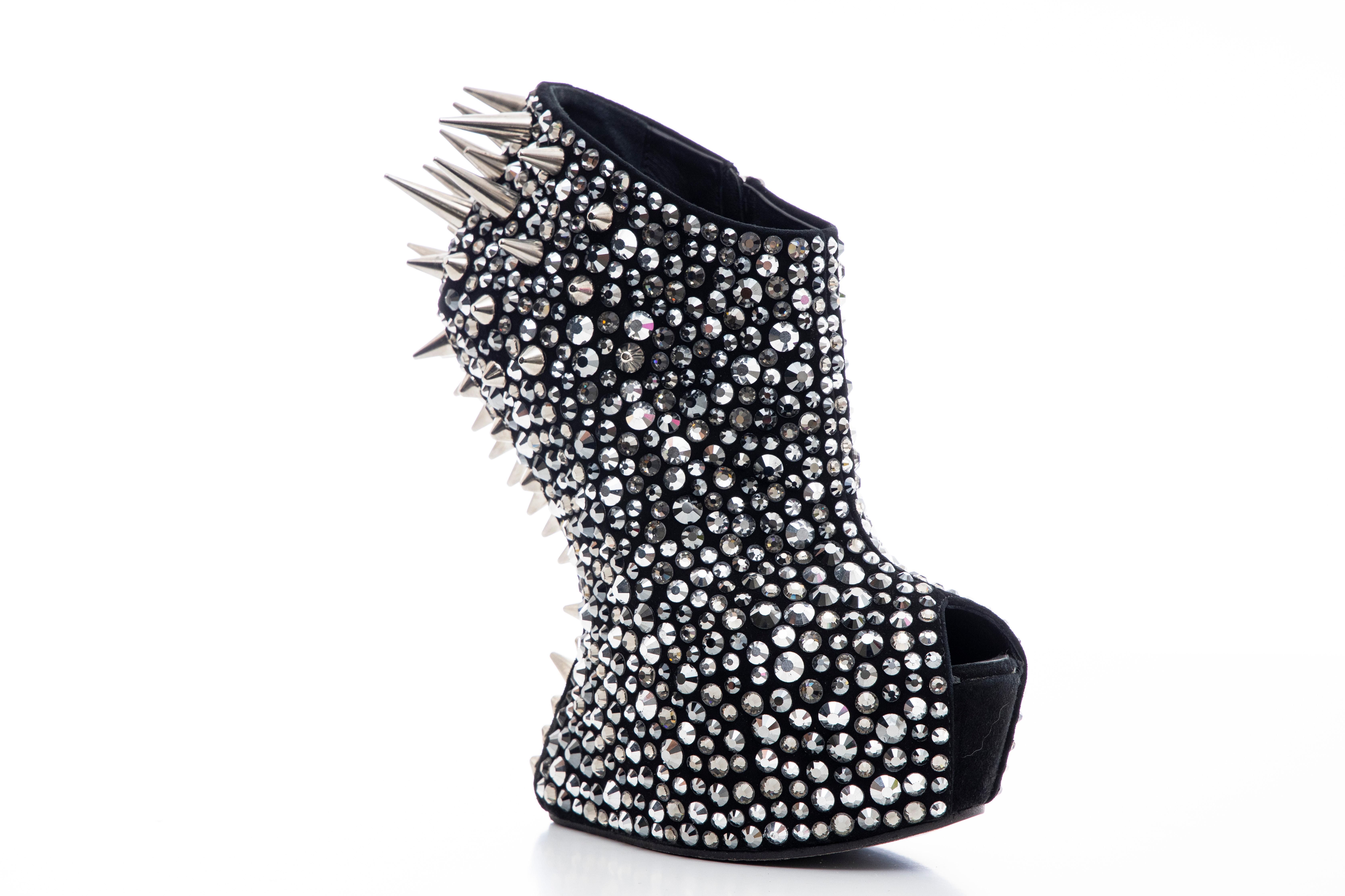 Giuseppe Zanotti, Autumn-Winter 2012, black suede platform ankle boots with strass adornments throughout, silver-tone spikes at counters, covered heels, and zip closure at insteps

Part of The Bata Shoe Museum in Gold Spikes.

Quote from The Bata