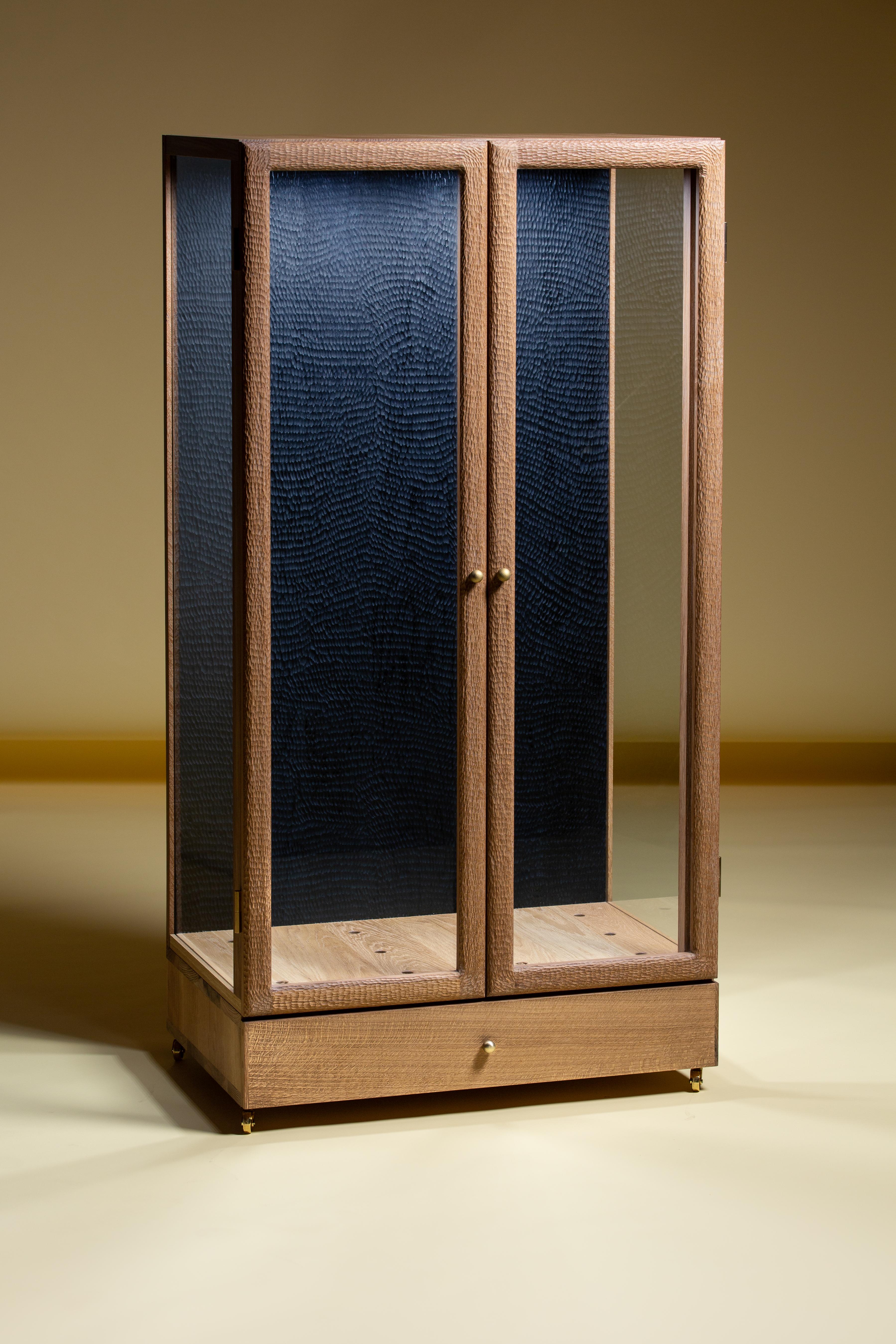 Dylan Moore Studio's white oak guitar cabinets are exquisite pieces of craftsmanship that combine traditional solid wood cabinet-making techniques with unique handcrafted details and finishes. These cabinets are designed to showcase and protect