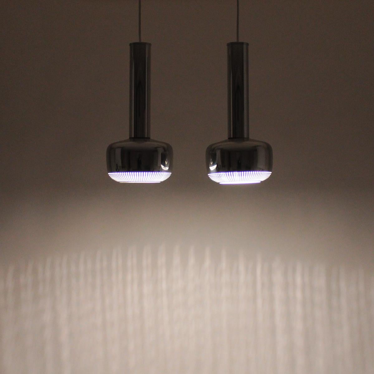 Guldpendel, Chrome ceiling lights by Danish architect Vilhelm Lauritzen in 1958 and produced by Louis Poulsen - Scandinavian Modern pendant pair in rare excellent vintage condition including their original boxes!

This minimalist pair of chromed