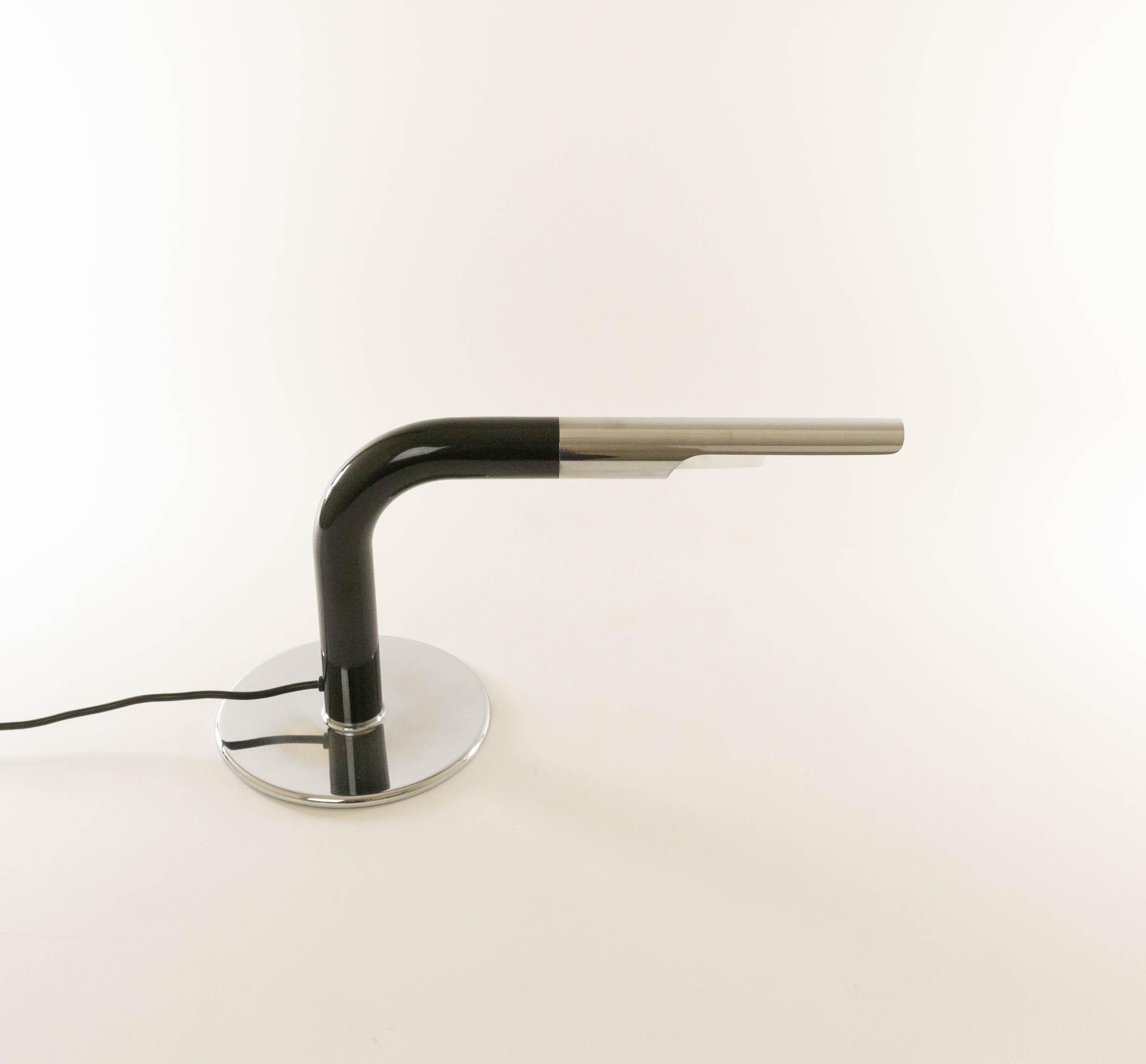 Gulp table lamp designed by Ingo Maurer and produced by his own company Design M. The tubular shaped lamp was designed in 1969 and it is made of chrome and black lacquered metal.

The condition of the lamp is very good. 

Gulp is part of the