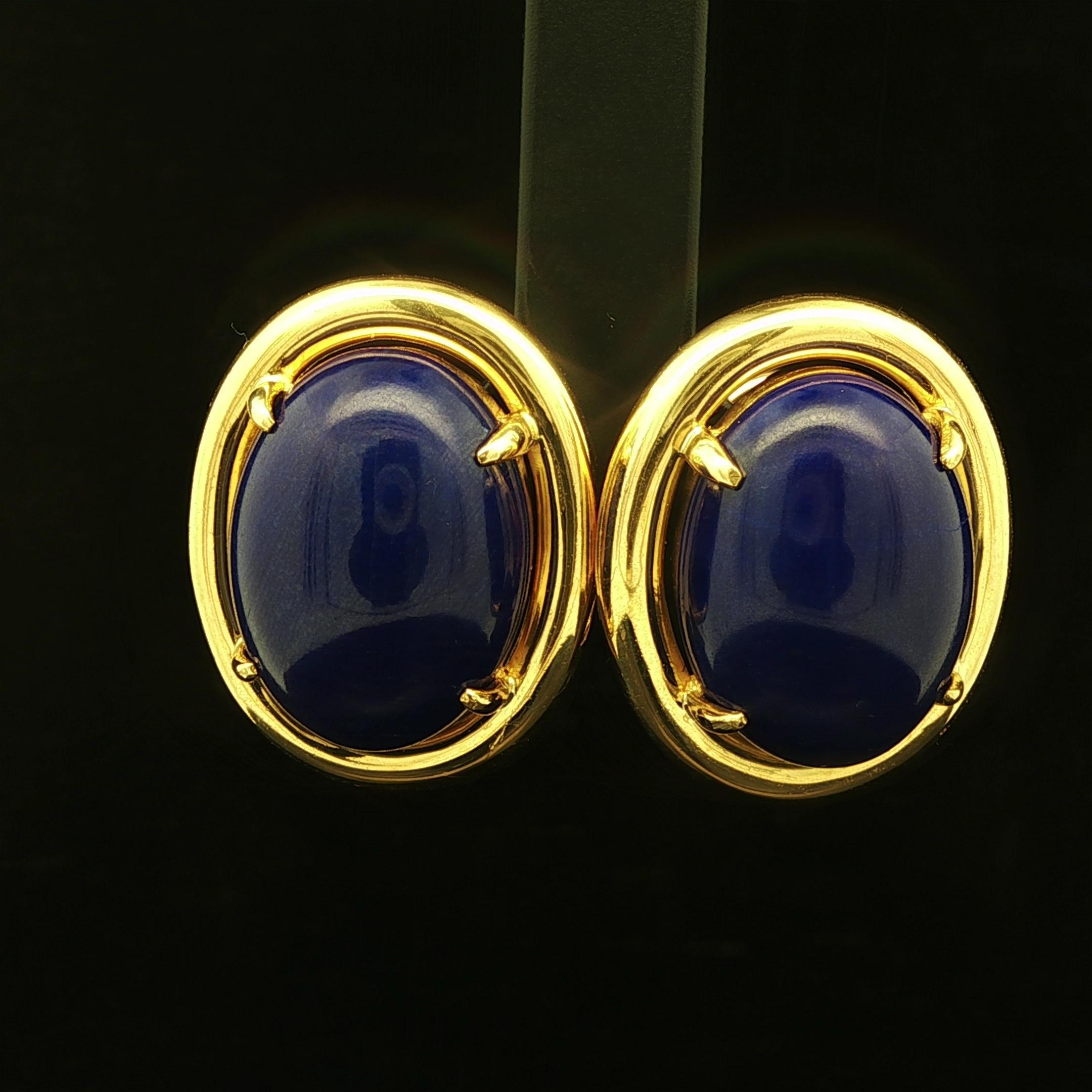 --Stone(s):--
(2) Natural Genuine Lapis Lazuli - Oval Cabochon Cut - Claw Prong Set - Deep Clean Blue Color - High Quality - 17.7x12.9mm each (approx.)

Material: Solid 18k Yellow Gold with 14k Gold Backs
Weight: 17.52 Grams
Backing: Post Backs w/