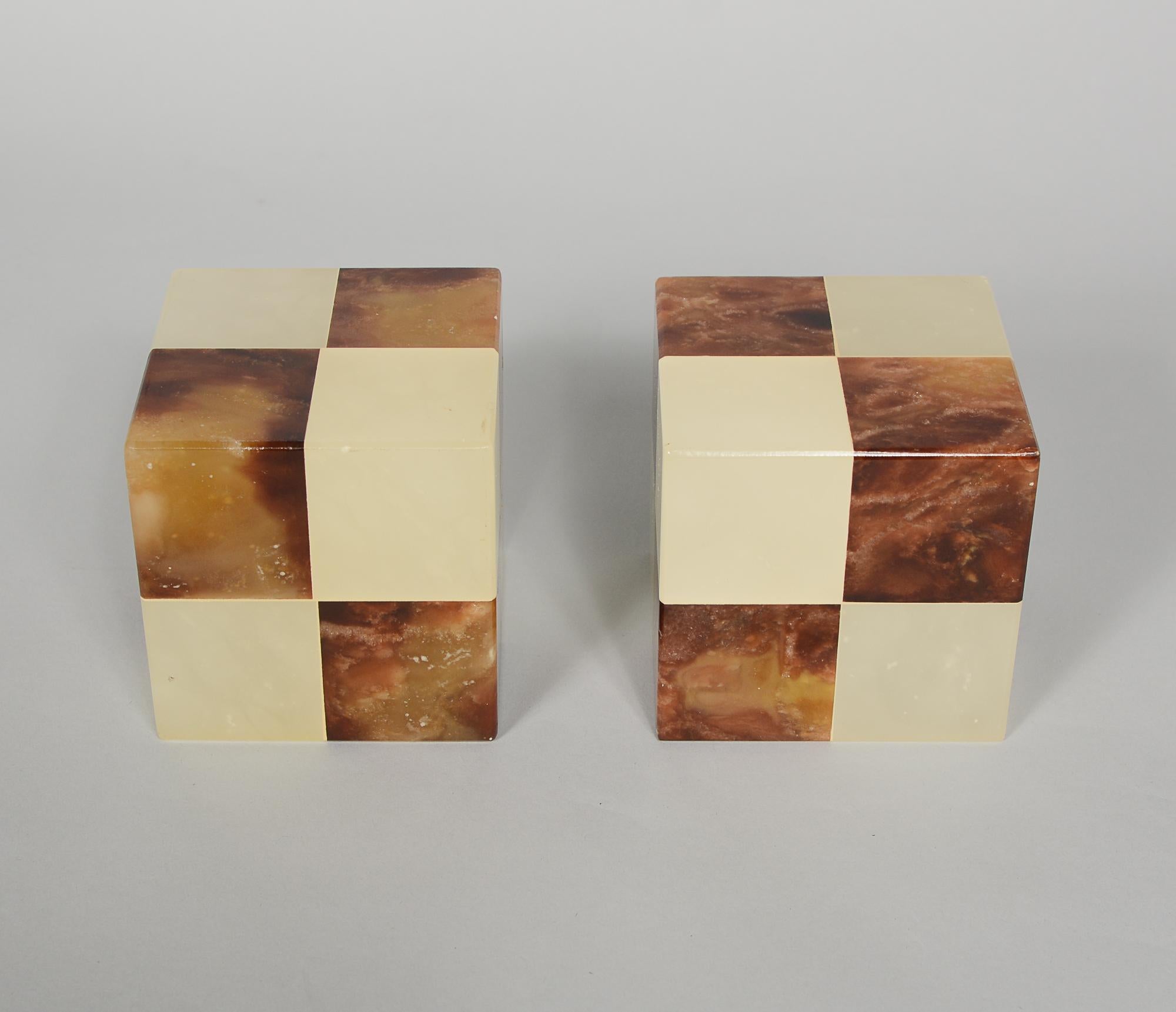Pair of Italian checkerboard alabaster bookends made expressly for Gump's of San Francisco. These retain original labels. There are a couple of small dings to the edges. One corner appears to be cracked.