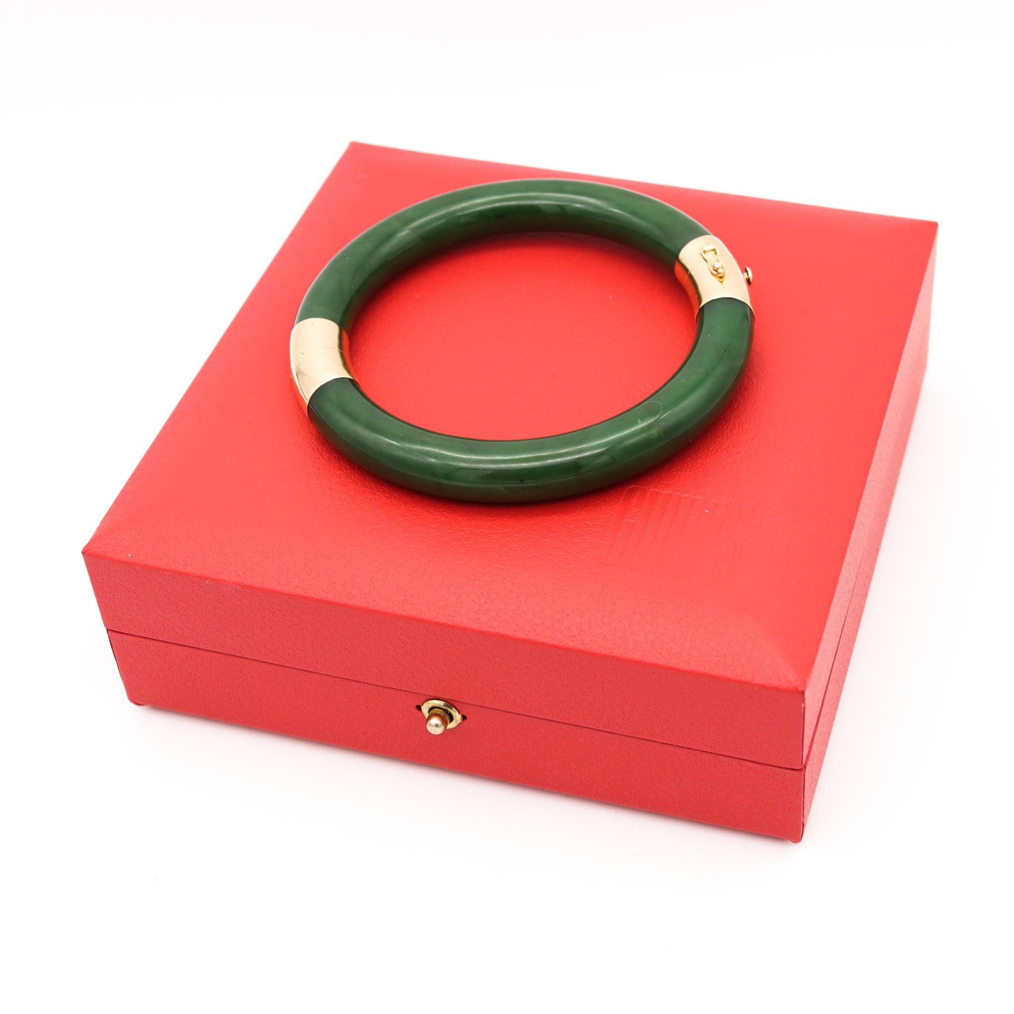 Green nephrite jade bracelet retailed by Gump's.

Beautiful vintage piece made by the iconic luxury store known as Gump's in San Francisco. This bangle bracelet was crafted with a pair of curved carvings of natural non dyed green nephrite jade and